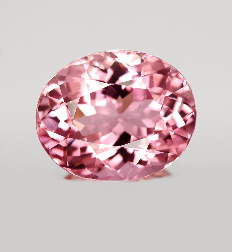Розовый ювелирный камень название. Розовый кварц турмалин камень. Турмалин родолит топаз. Розовый камень в ювелирных. Розовый полудрагоценный камень.
